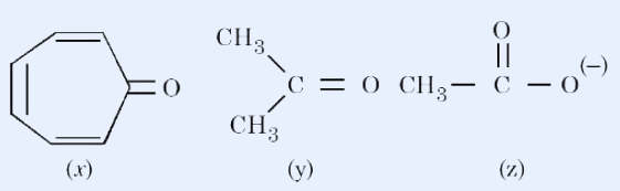 Three structures labelled (x), (y), (z). (x) is a seven-membered carbocyclic ring (cycloheptatrienone) with three conjugated C=C bonds and a C=O group. (y) is acetone with two CH3 groups attached to a central carbon doubly bonded to O. (z) is the acetate anion CH3-C(=O)-O(-) with one C-O double bond and one C-O single bond bearing a negative charge.